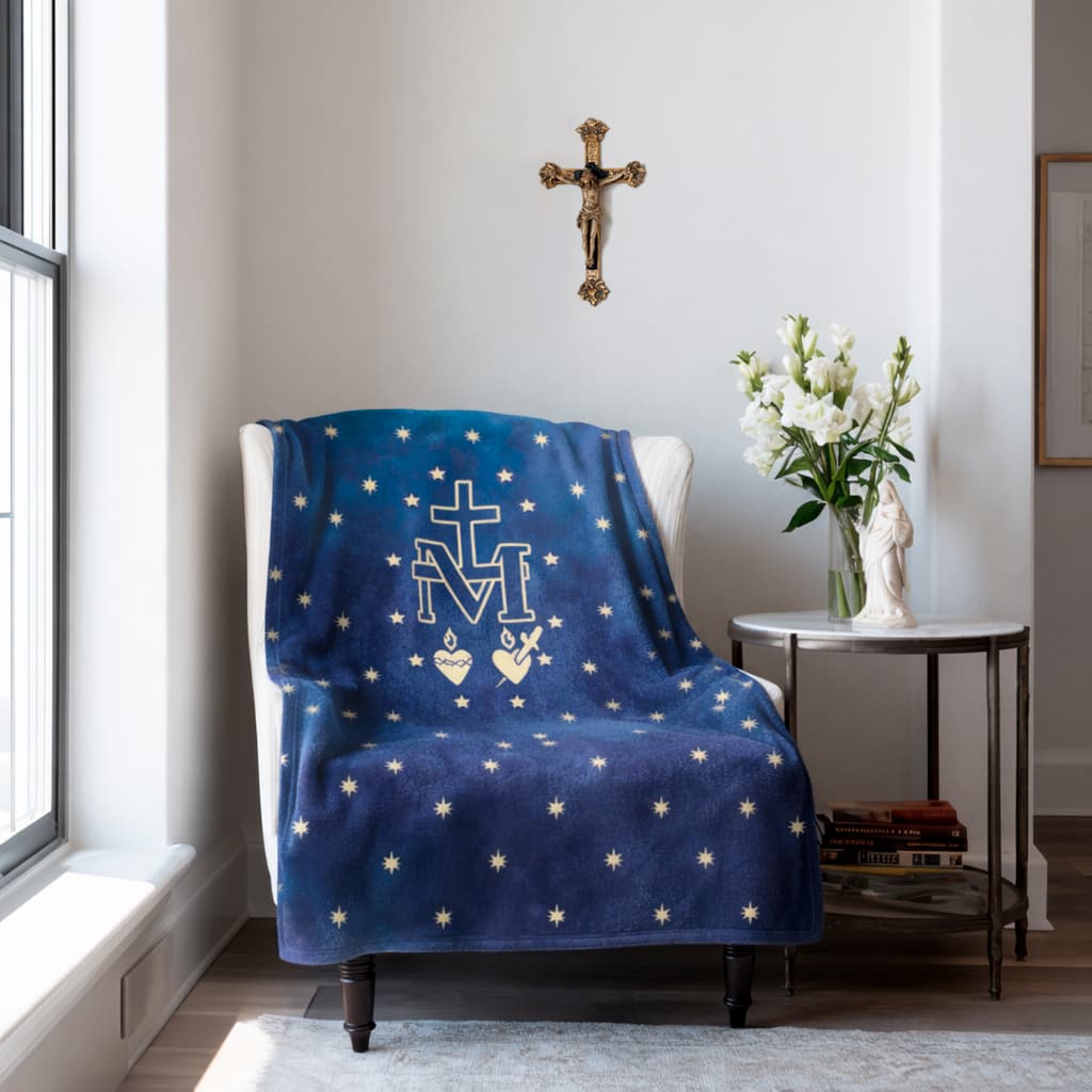 Miraculous Medal Marian blanket displayed on a chair